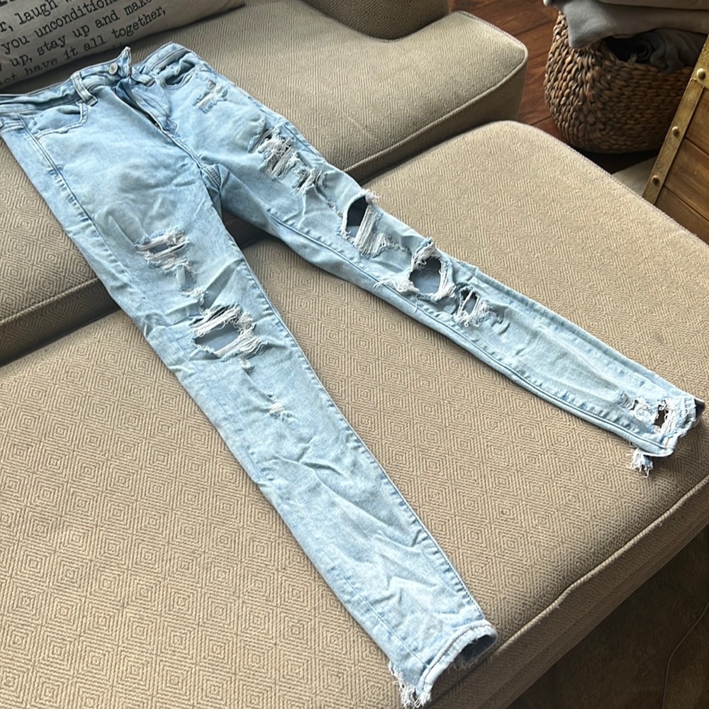 Very light blue wash extreme distressed jeans American eagle size 4